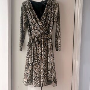 DKNY wrap style dress. Snake skin pattern in brown, black and beige. Blk slip.